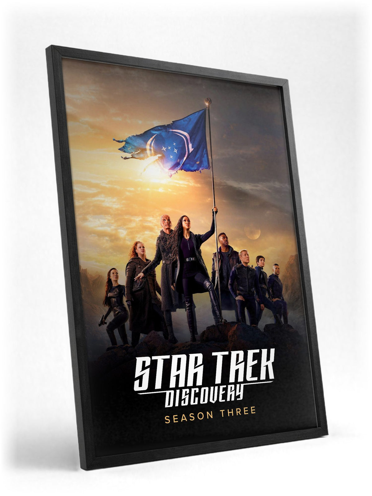 Star Trek: Discovery poster in a black frame with glass leaning against a wall