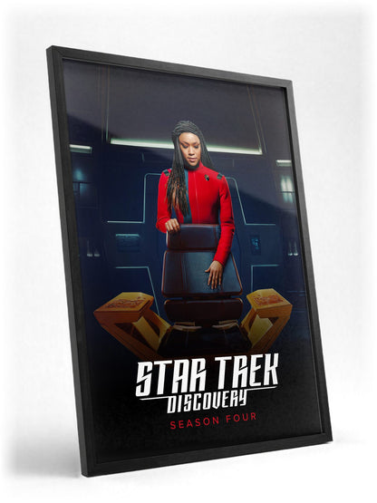 Star Trek: Discovery poster in a black frame with glass leaning against a wall
