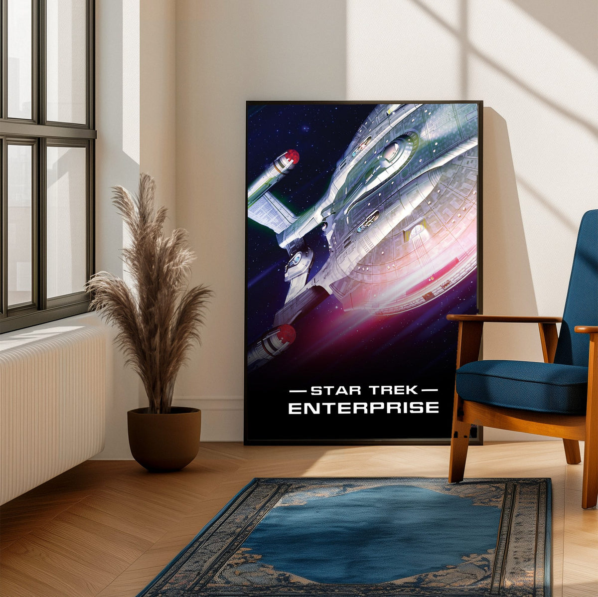 Star Trek: Enterprise poster framed beside a blue armchair in a sunlit room