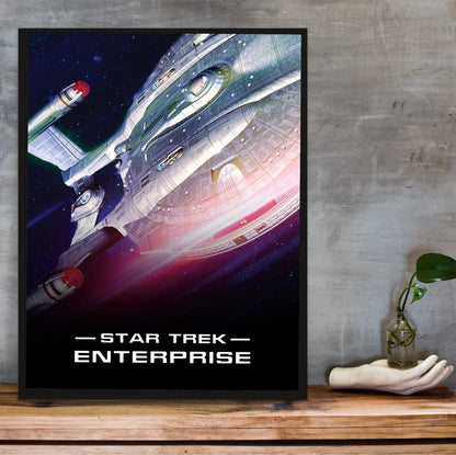 Star Trek: Enterprise poster in a black frame on a wooden shelf against concrete