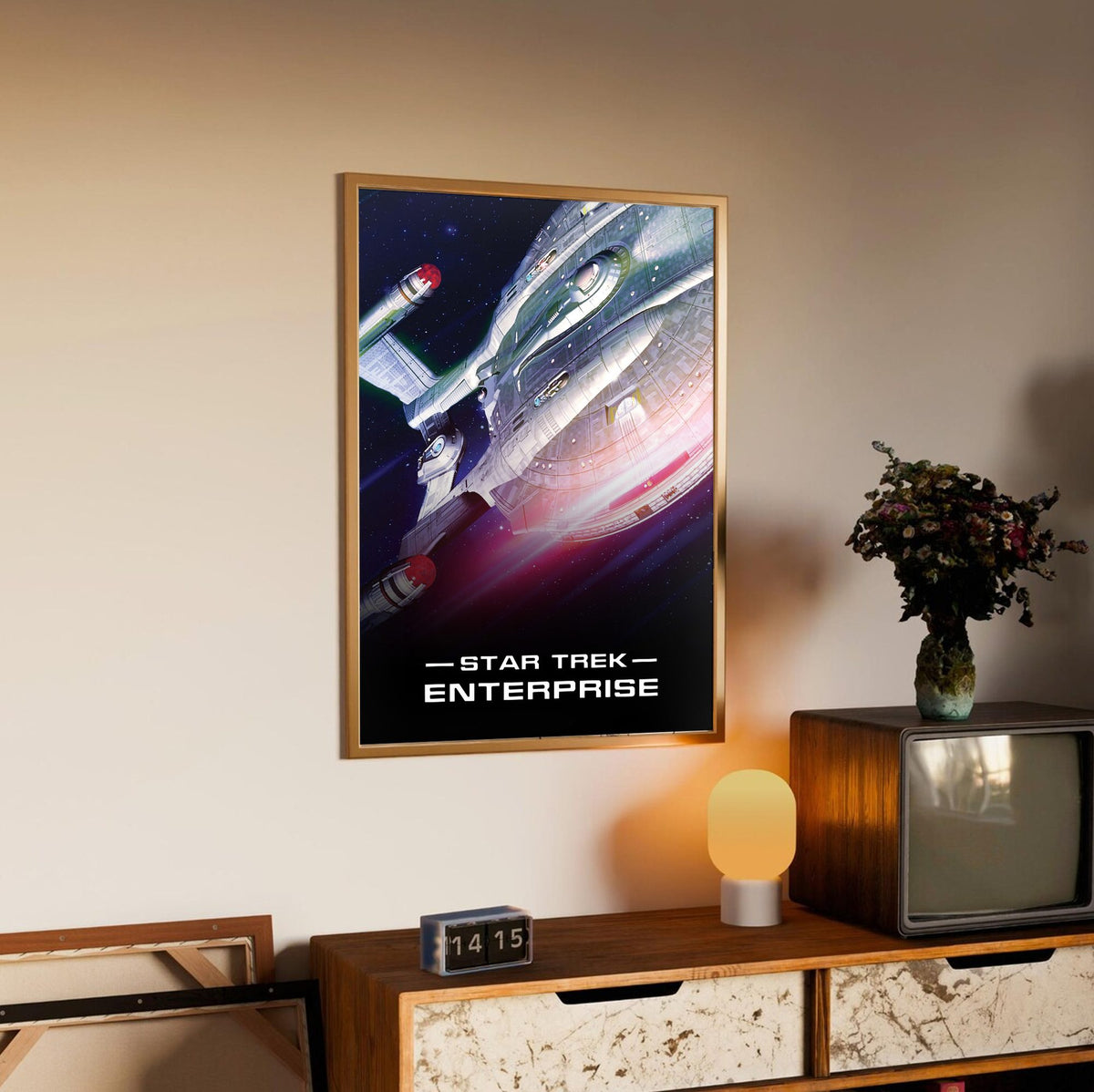 Star Trek: Enterprise poster in an oak frame above a sideboard