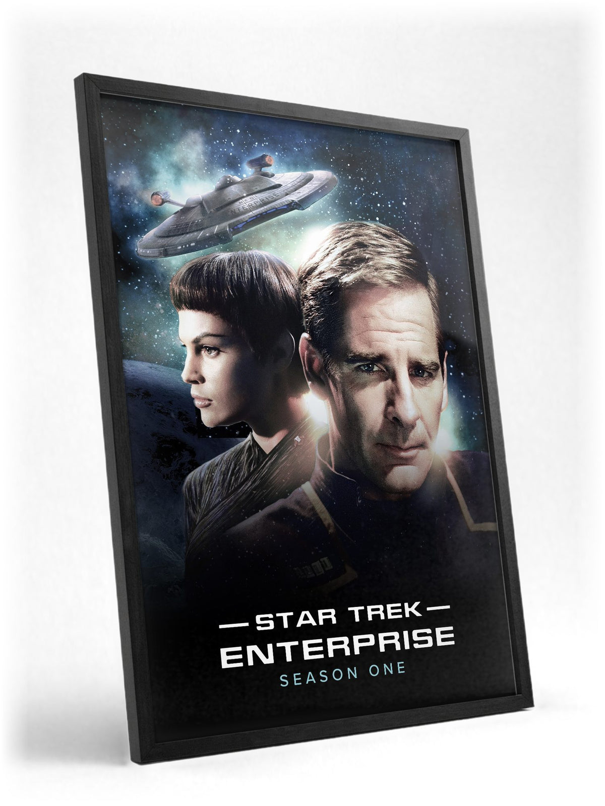 Star Trek: Enterprise poster in a black frame with glass leaning against a wall