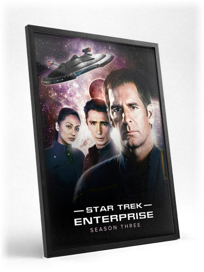 Star Trek: Enterprise poster in a black frame with glass leaning against a wall