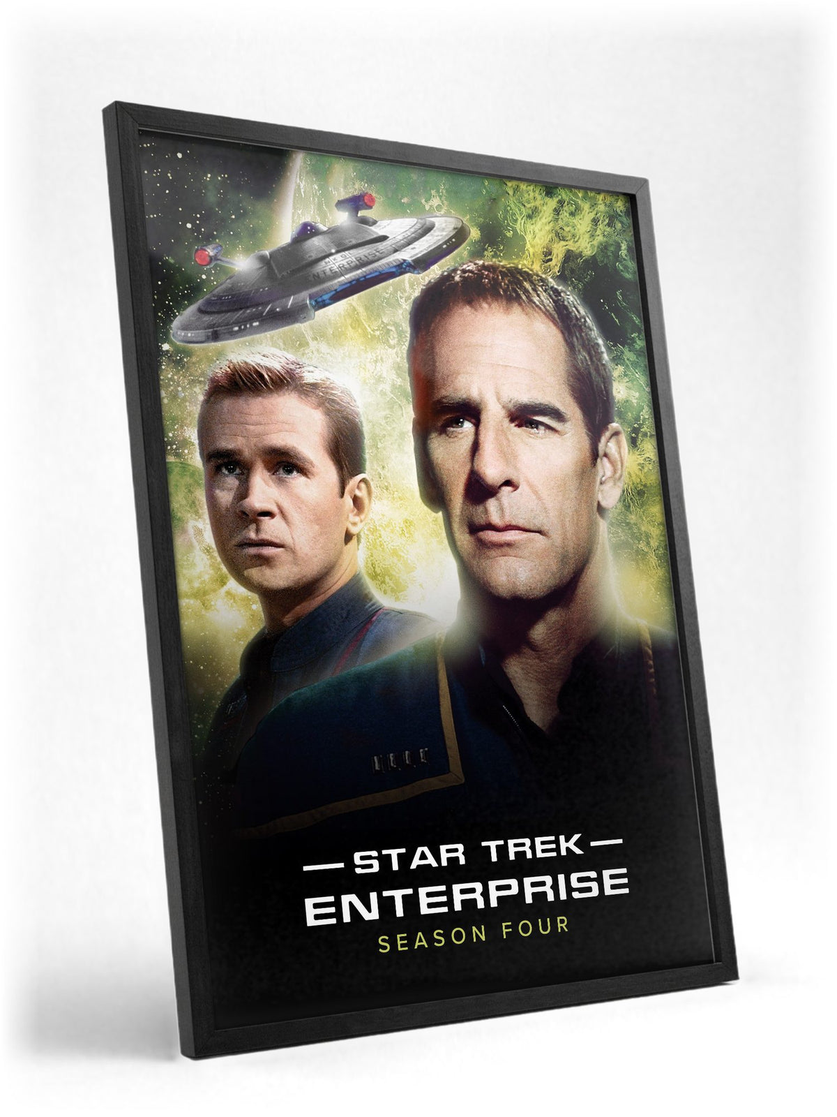 Star Trek: Enterprise poster in a black frame with glass leaning against a wall
