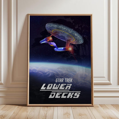 Star Trek: Lower Decks poster in a light oak frame leaning against a white wall