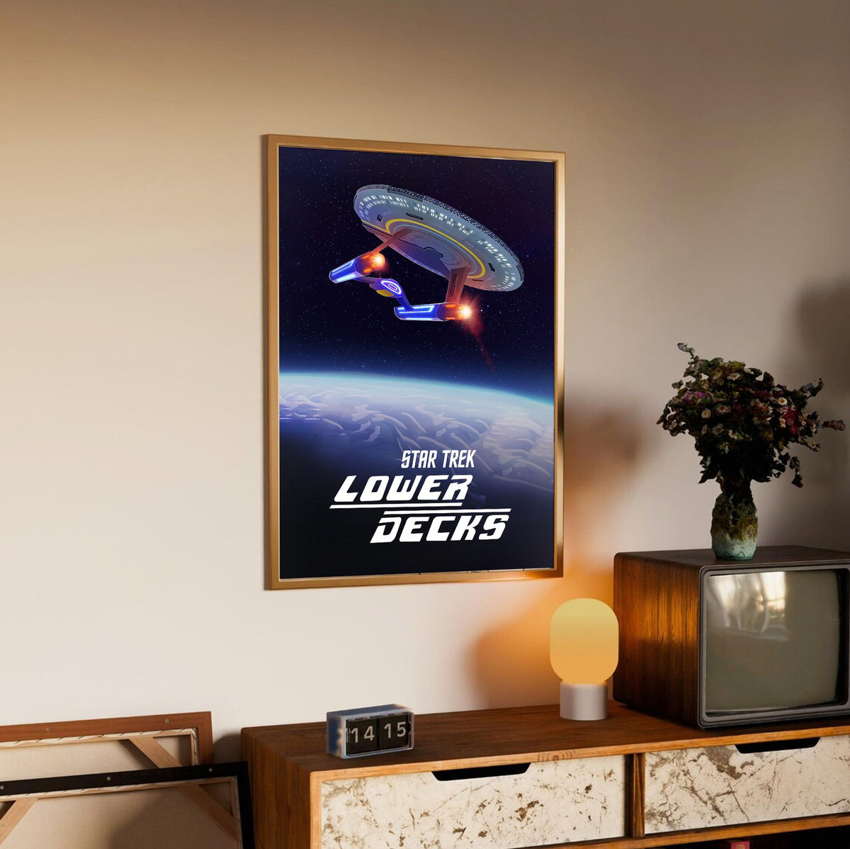 Star Trek: Lower Decks poster in an oak frame above a sideboard