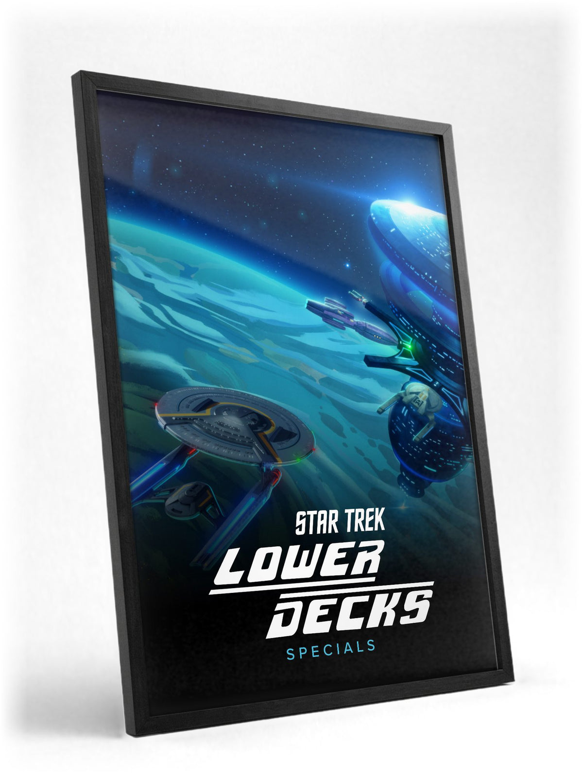 Star Trek: Lower Decks poster in a black frame with glass leaning against a wall