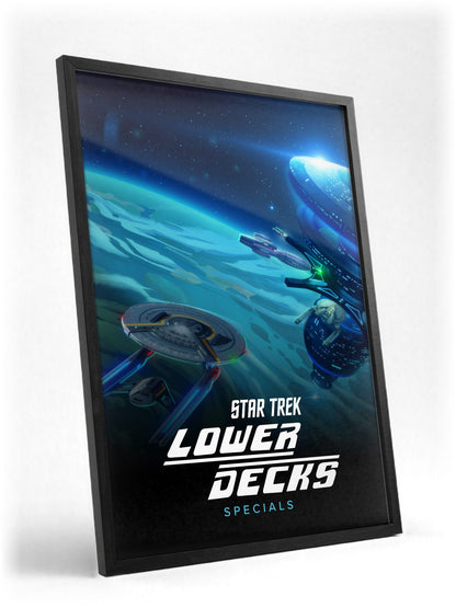 Star Trek: Lower Decks poster in a black frame with glass leaning against a wall