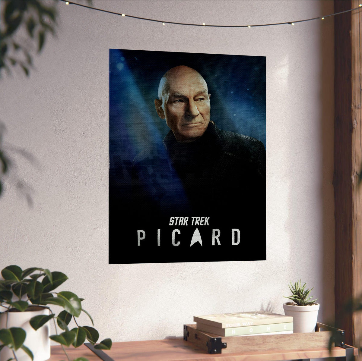 Star Trek: Picard poster unframed on a white wall above a desk