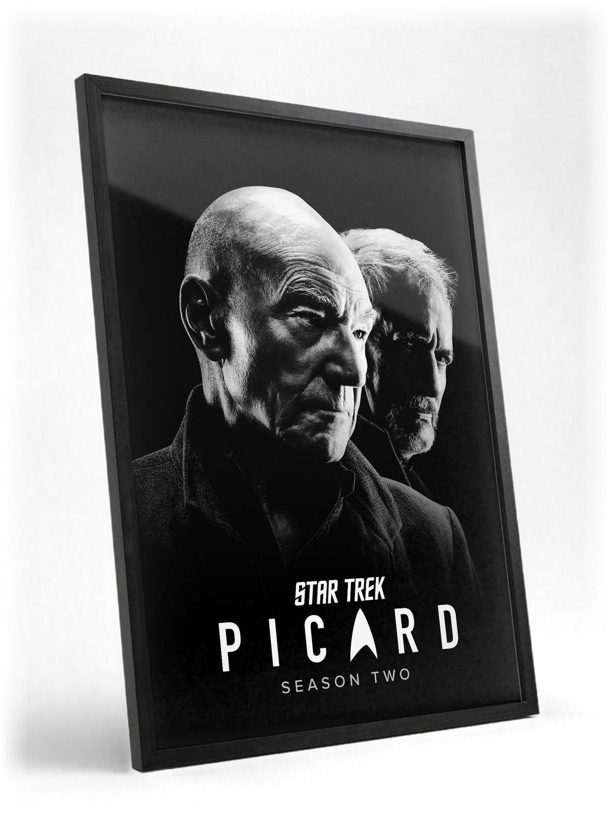 Star Trek: Picard poster in a black frame with glass leaning against a wall