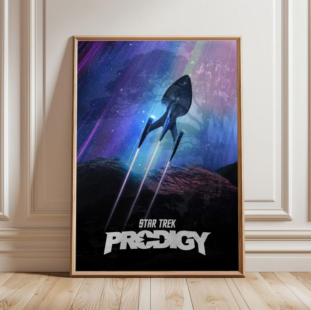 Star Trek: Prodigy poster in a light oak frame leaning against a white wall