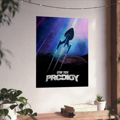 Star Trek: Prodigy poster unframed on a white wall above a desk