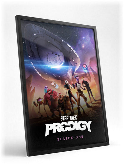 Star Trek: Prodigy poster in a black frame with glass leaning against a wall