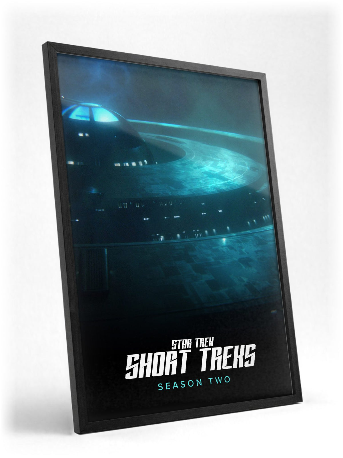 Star Trek: Short Treks poster in a black frame with glass leaning against a wall