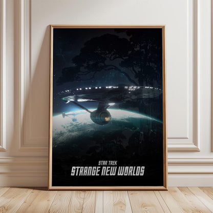 Star Trek: Strange New Worlds poster in a light oak frame leaning against a white wall