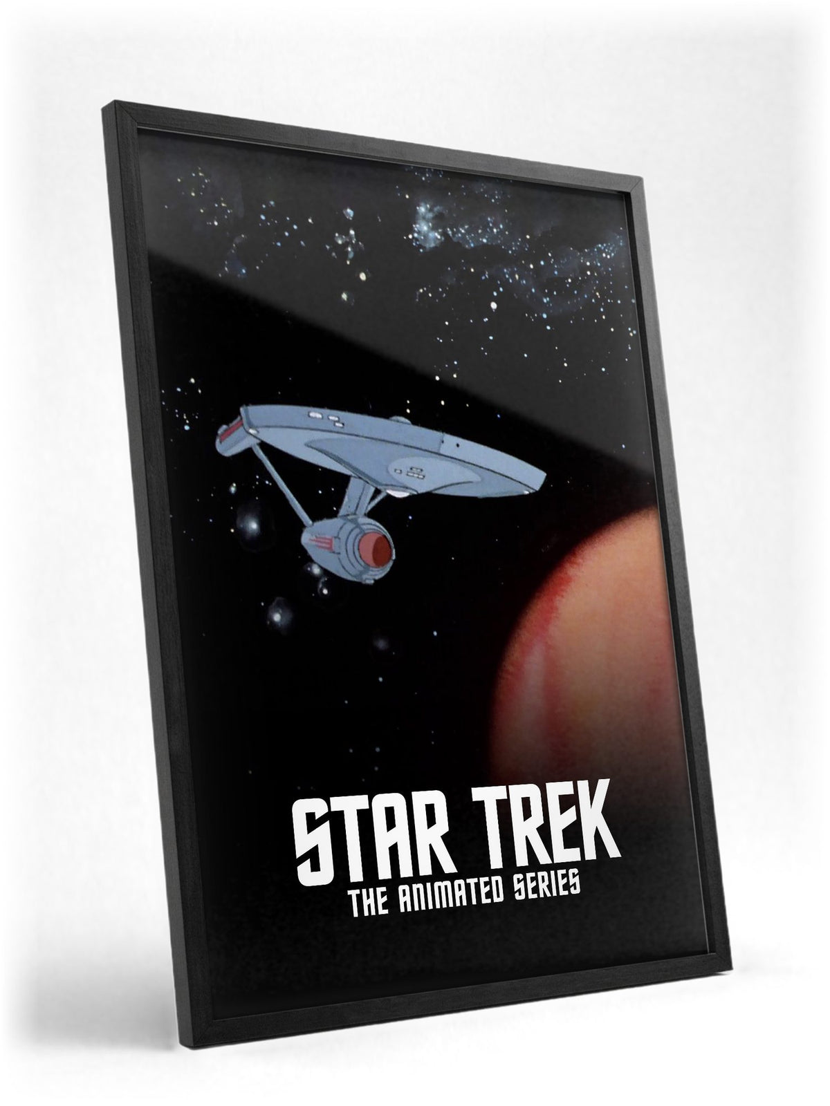 Star Trek: The Animated Series poster in a black frame with glass leaning against a wall