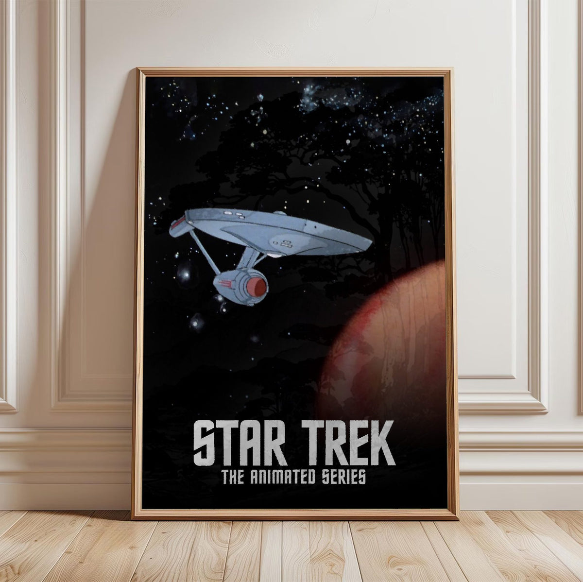 Star Trek: The Animated Series poster in a light oak frame leaning against a white wall