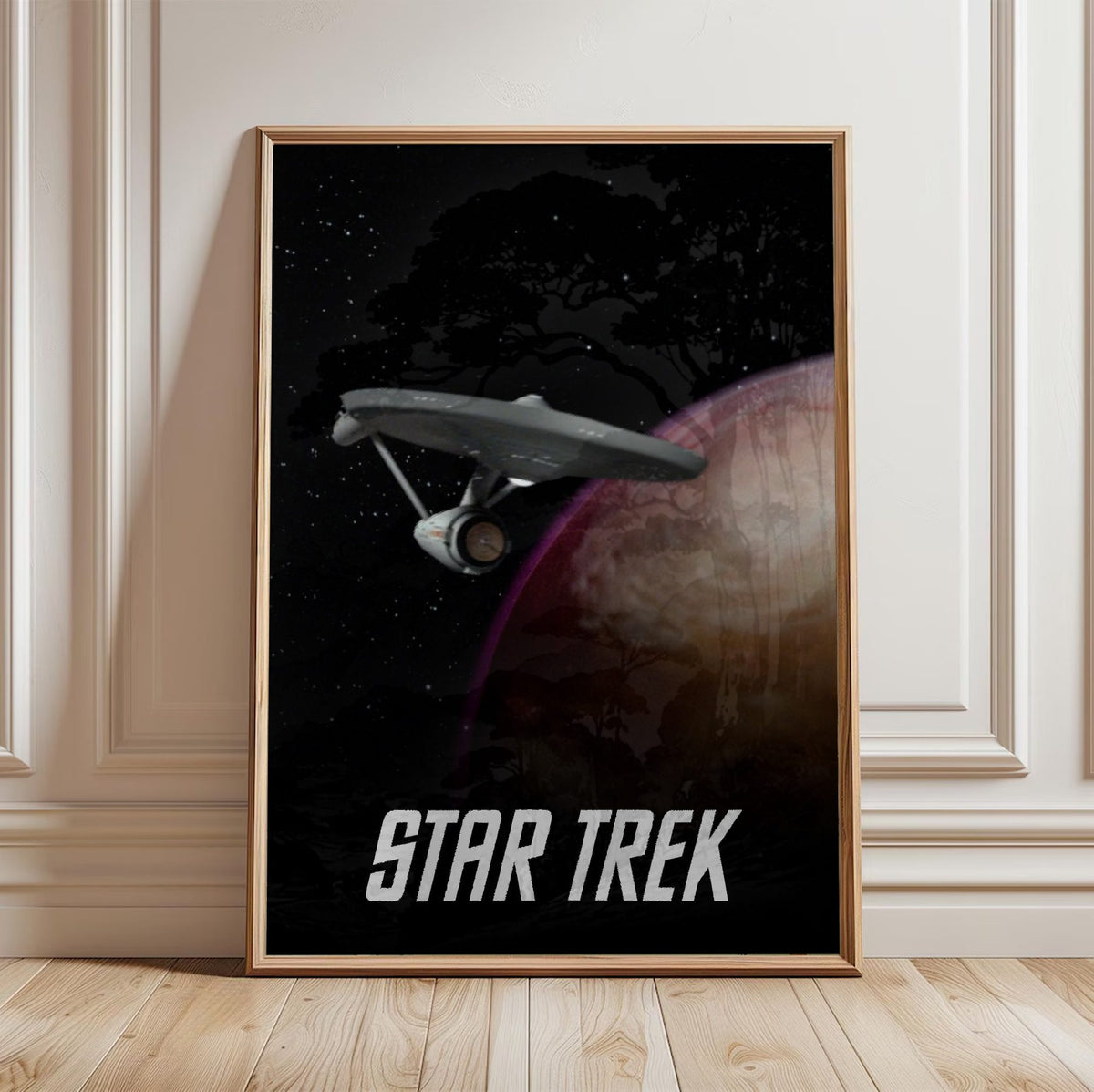 Star Trek: The Original Series poster in a light oak frame leaning against a white wall