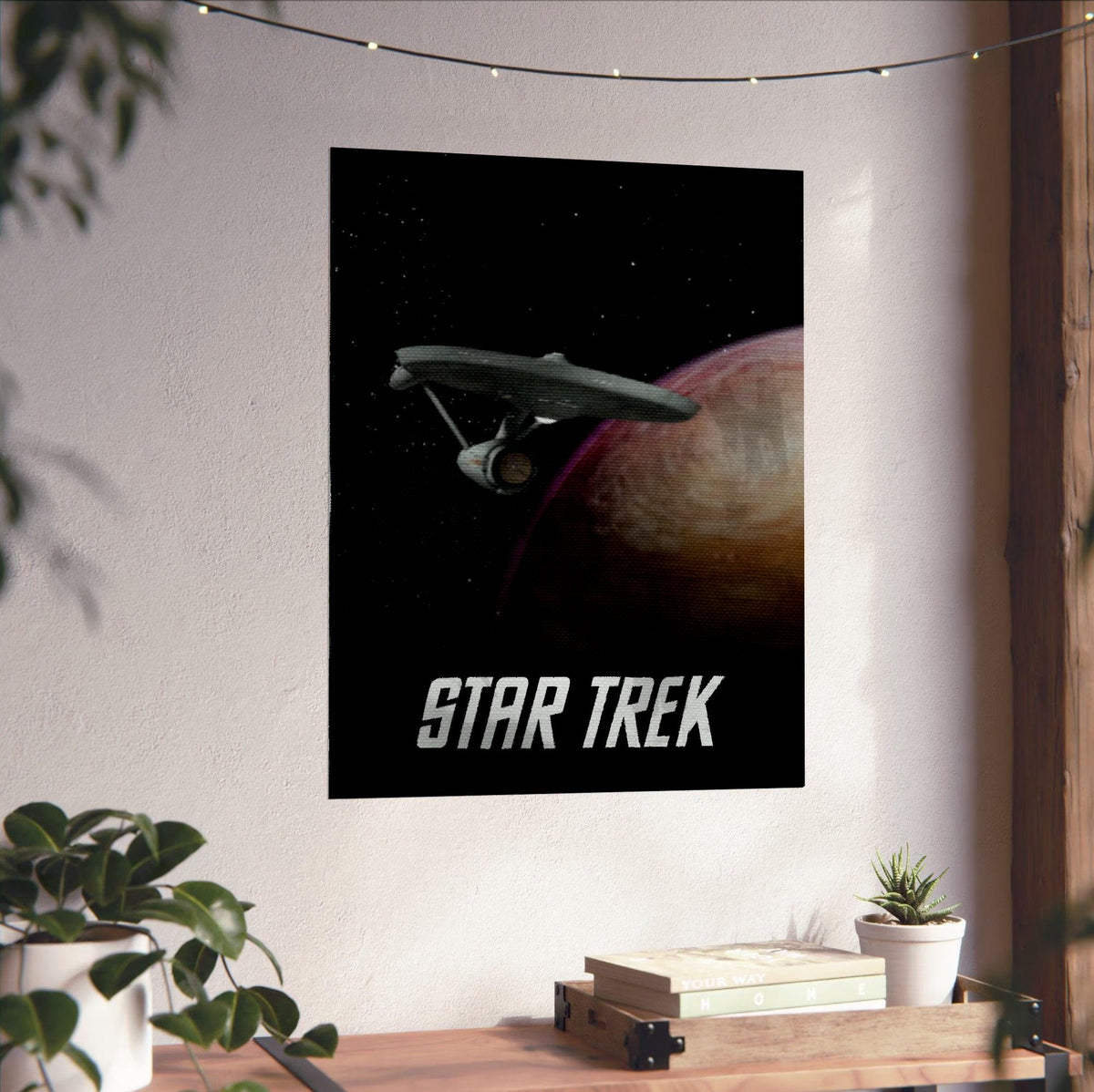Star Trek: The Original Series poster unframed on a white wall above a desk