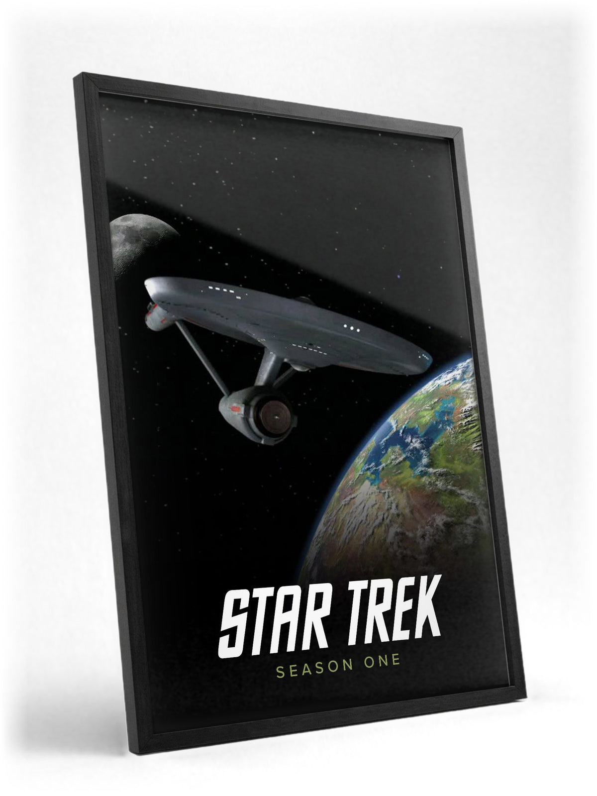 Star Trek: The Original Series poster in a black frame with glass leaning against a wall