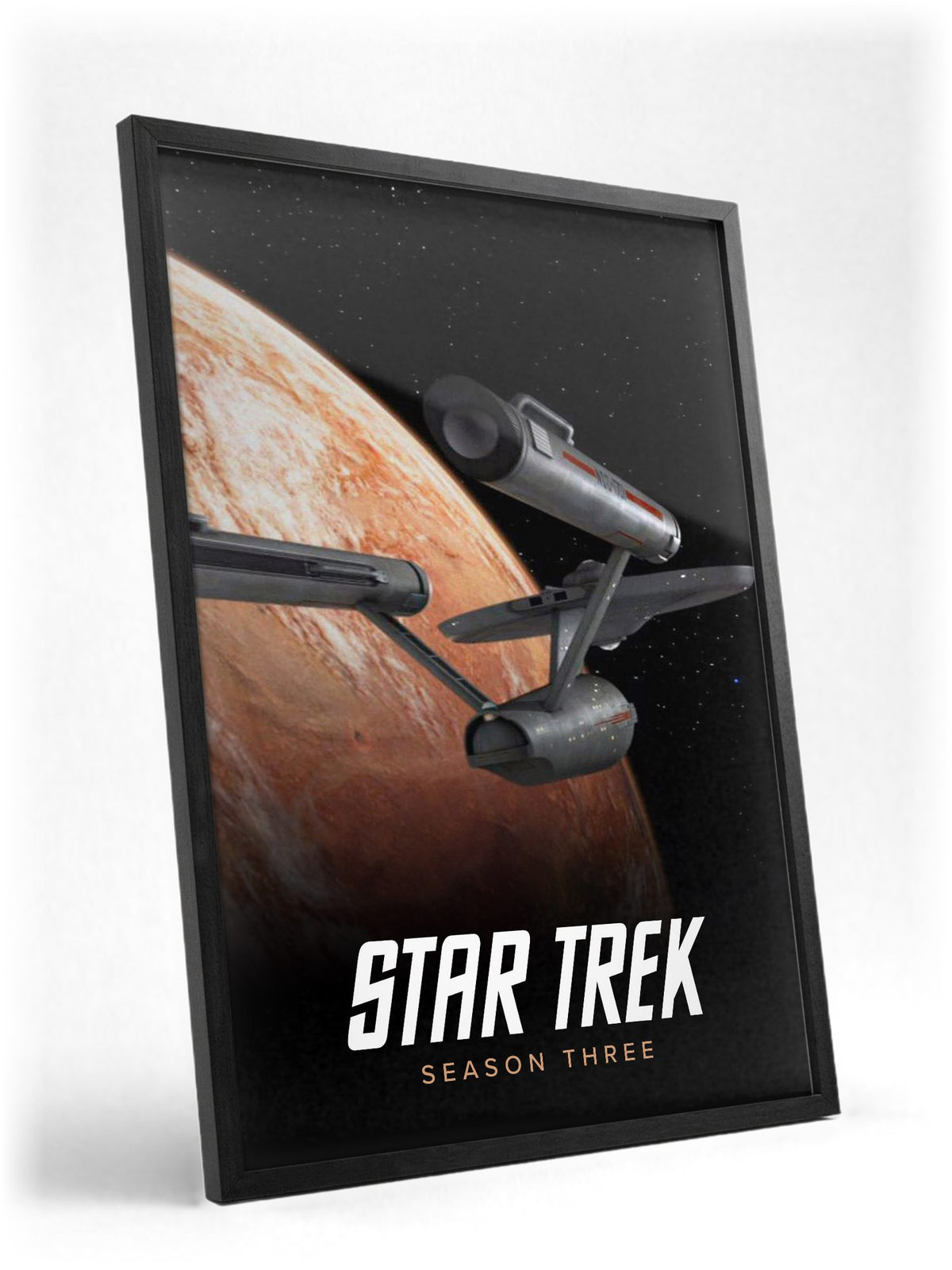 Star Trek: The Original Series poster in a black frame with glass leaning against a wall