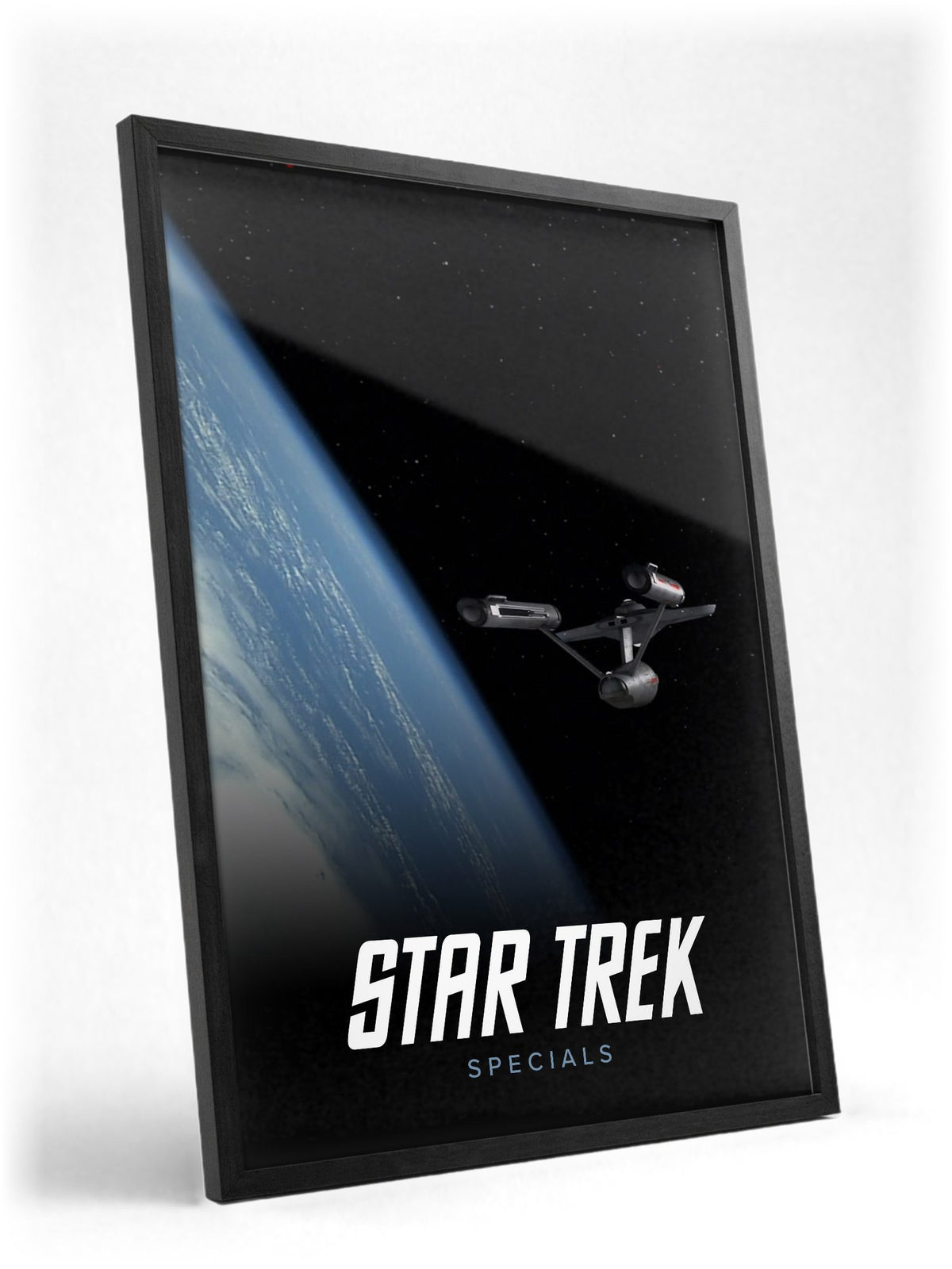Star Trek: The Original Series poster in a black frame with glass leaning against a wall