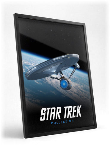 Star Trek TV Collection Art poster in a black frame with glass leaning against a wall