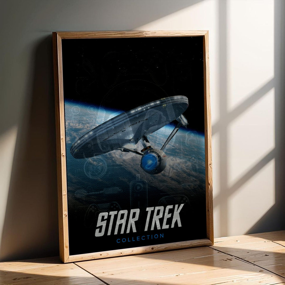 Star Trek TV Collection Art poster in an oak frame leaning on a wooden floor