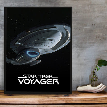 Star Trek: Voyager poster in a black frame on a wooden shelf against concrete
