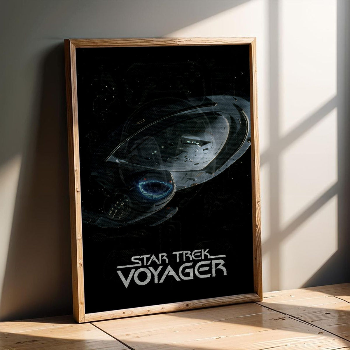Star Trek: Voyager poster in an oak frame leaning on a wooden floor