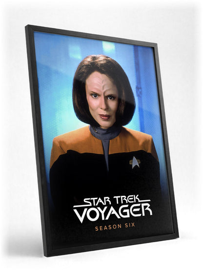 Star Trek: Voyager poster in a black frame with glass leaning against a wall