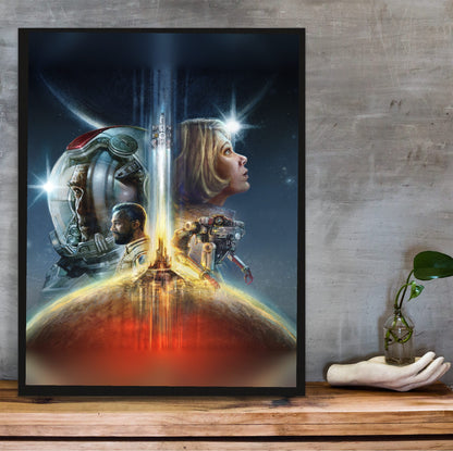 Starfield Key Art poster in a black frame on a wooden shelf against concrete