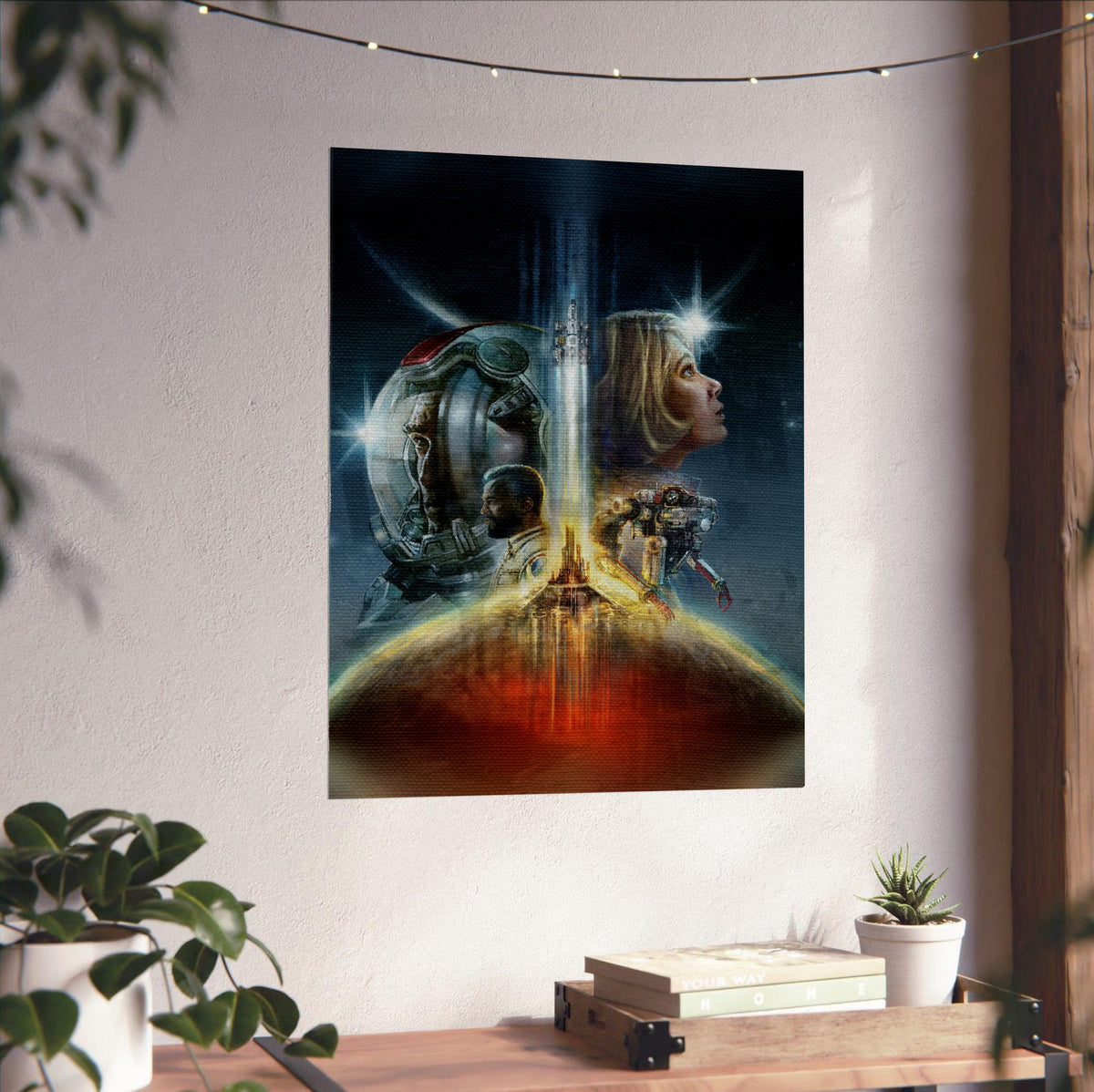 Starfield Key Art poster unframed on a white wall above a desk