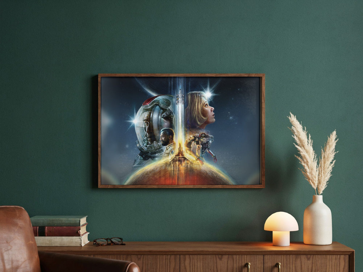 Starfield Key Art poster in a dark walnut frame in a green study
