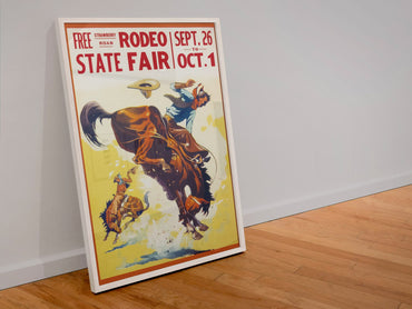 State Fair Rodeo Bronc Rider poster in a white frame leaning against a wall