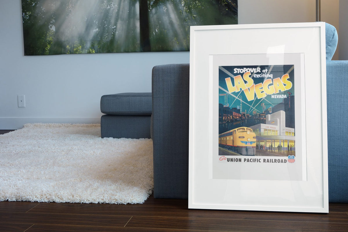 Exciting Las Vegas Union Pacific poster leaning beside a blue sofa