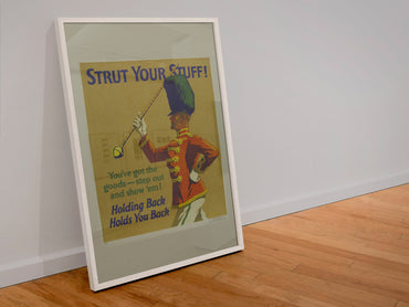 Strut Your Stuff poster in a white frame leaning against a wall