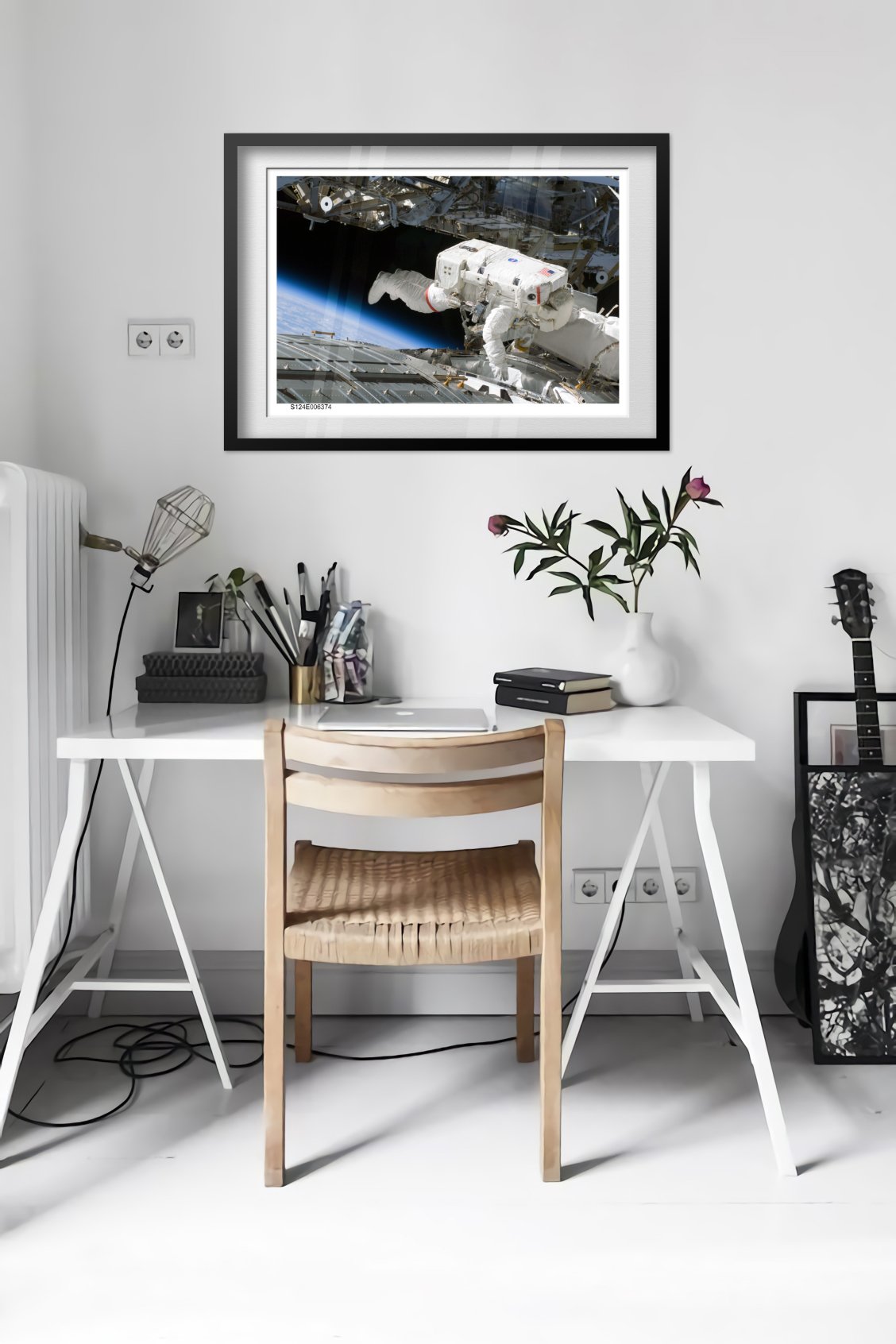 STS-124 Discovery astronaut spacewalk poster framed in a bright home office