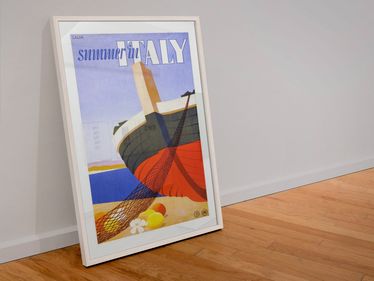 Summer in Italy poster in a white frame leaning against a wall