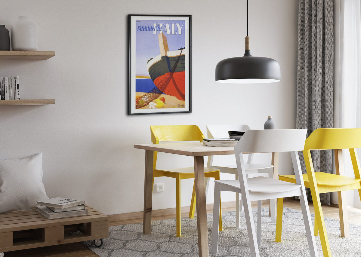 Summer in Italy poster framed above a dining table