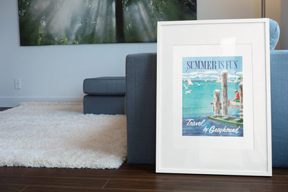 Summer is Fun Greyhound poster leaning beside a blue sofa