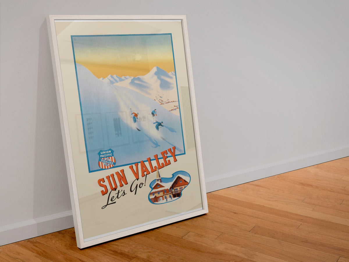 Sun Valley Union Pacific poster in a white frame leaning against a wall