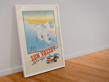 Sun Valley Union Pacific poster in a white frame leaning against a wall