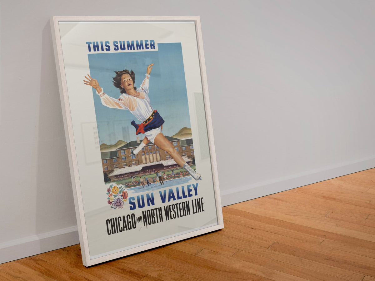 Sun Valley Ice Skating poster in a white frame leaning against a wall