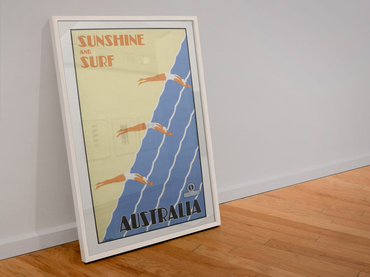 Sunshine and Surf Australia poster in a white frame leaning against a wall