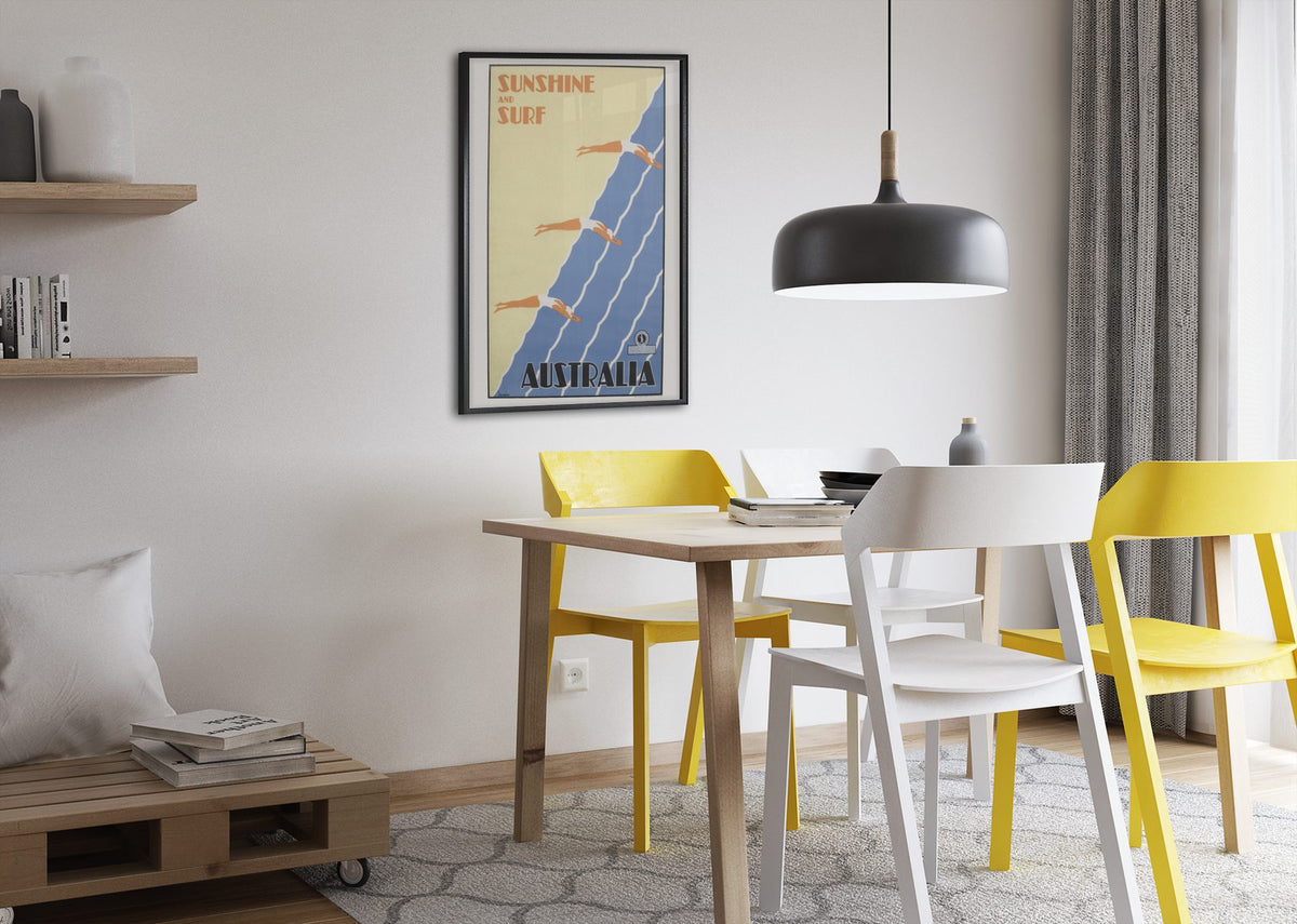 Sunshine and Surf Australia poster framed above a dining table