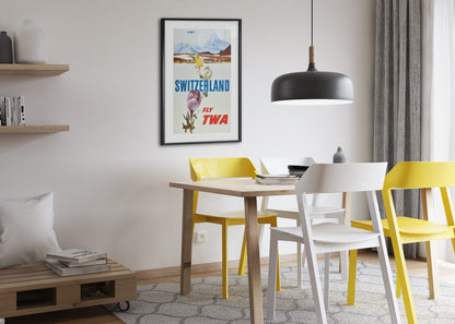 Switzerland Fly TWA poster framed above a dining table