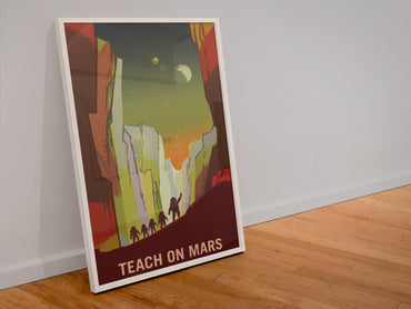 Teach on Mars poster in a white frame leaning against a wall