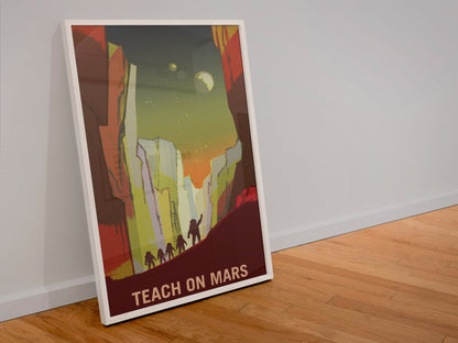 Teach on Mars poster in a white frame leaning against a wall