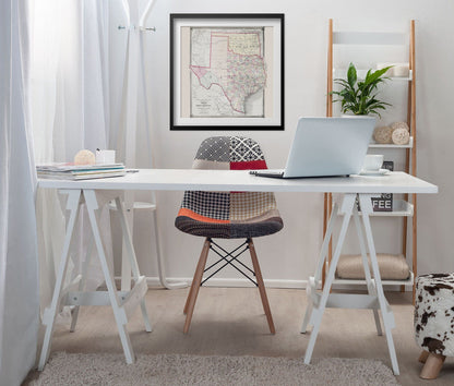 Texas Counties 1875 Map print framed above a white desk in a home office